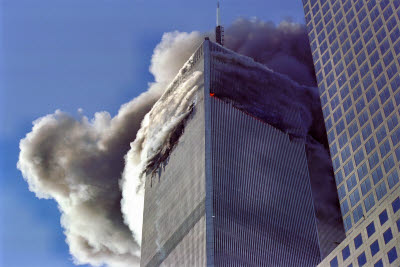 First tower burns while plane hits second building.