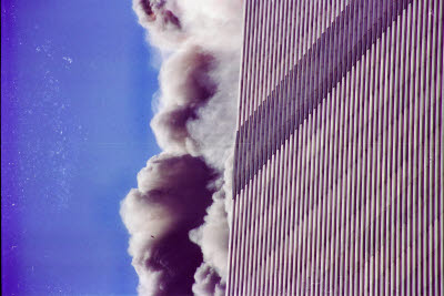 Explosion from second plane seen behind first building attacked