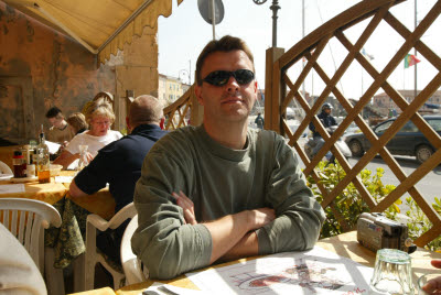 K.C. enjoying a harborside meal in Portoferraio