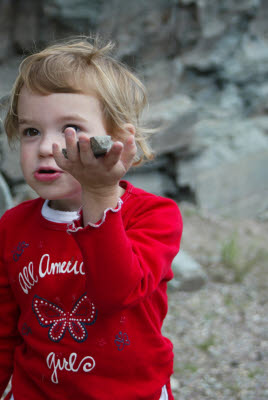 Emma shows a rock she collected