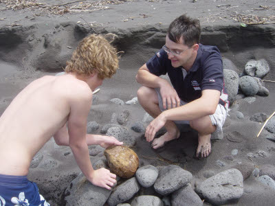 Alex and Mark crackin' coconuts