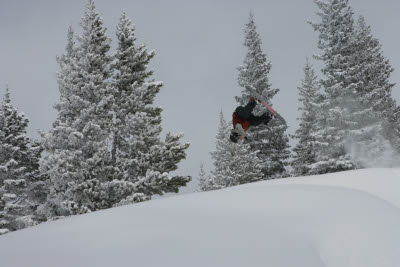 Snowboarder does flip