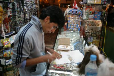 Raul signs Christmas Cards