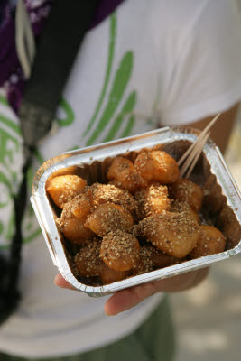 Donuts w/Sesame seeds, packed to go w/toothpicks