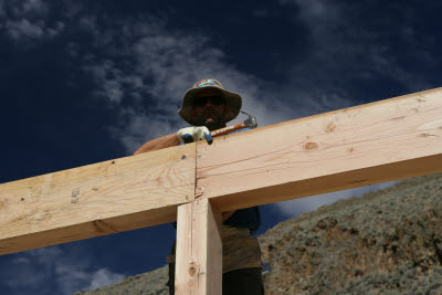 Metal beam straps being nailed into place