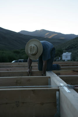 Justin nails joists into brackets