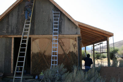 Installing and staining the last bits of siding